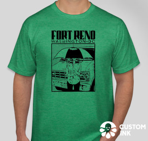 Green Fort Reno T-shirt depicting a person holding an umbrella